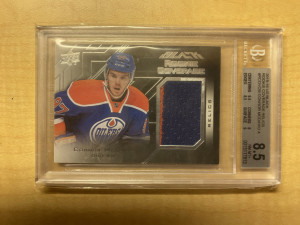 Connor McDavid 2015-16 Upper Deck Black Rookie Coverage Jersey BGS 8.5 front